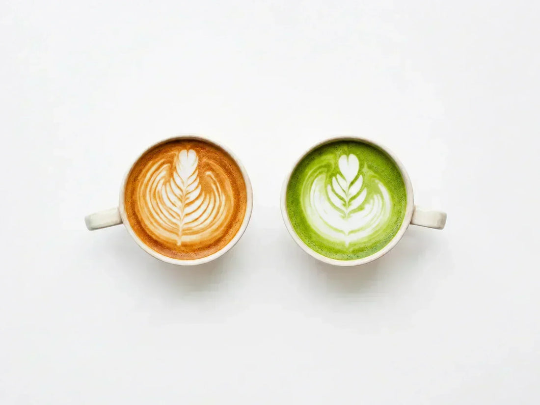 Cups of latte and matcha latte with latte art, side by side for comparison
